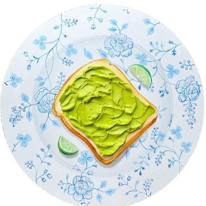 Textured impasto oil painting of an avocado toast brunch plate by Christina Kunanets