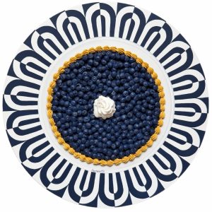 Textured impasto oil painting of a blueberry tart on a vintage plate by Christina Kunanets