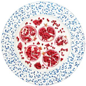 Textured impasto oil painting of pomegranate fruit in a still life by Christina Kunanets