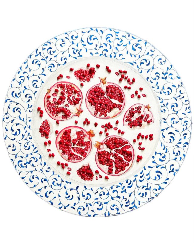Textured impasto oil painting of pomegranate fruit in a still life by Christina Kunanets
